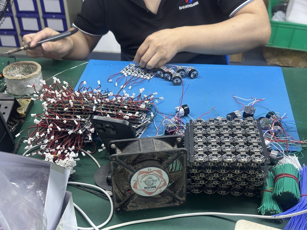 Lightsaber core and LED strip being installed by a worker